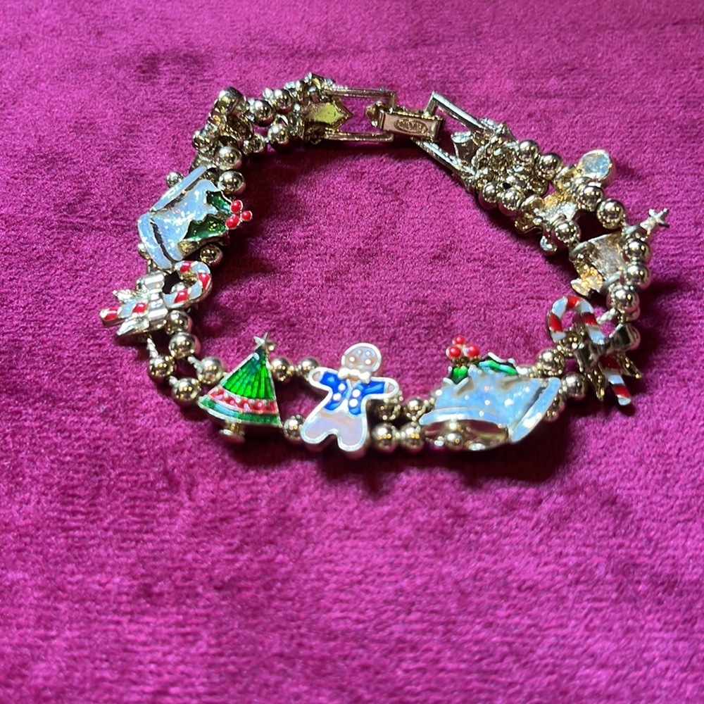 Previously Owned Avon Christmas Slide Bracelet Enamel Charms Gold Tone.